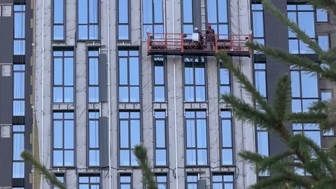 Construction Workers Climbing Up The Building On A Scaffold Stock Footage 254317260
