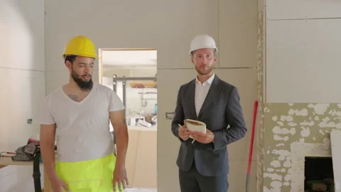 Construction Workers Collaborating Together on a Major Project for an Upcoming Vídeo Stock 307539982
