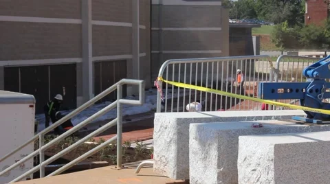 Construction workers on a college campus Stock Footage 44446439