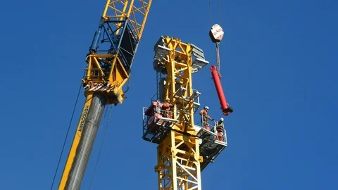 Construction workers constructing giant crane on building site leeds Stock Footage 91782973