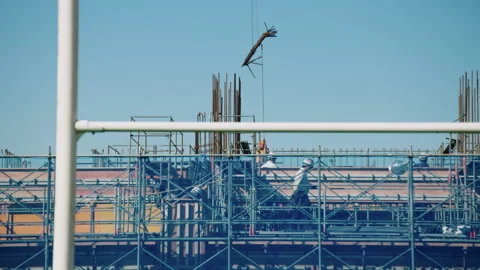 Construction workers on a construction site in Japan building a sports stadium 스톡 동영상 130377764
