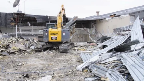 Construction workers control heavy machinery on demolition site B 스톡 동영상 125056450