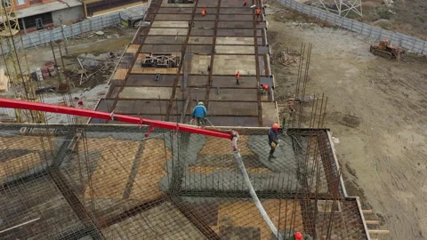 Construction workers cover upper floor with concrete by pump Video stock 144327744