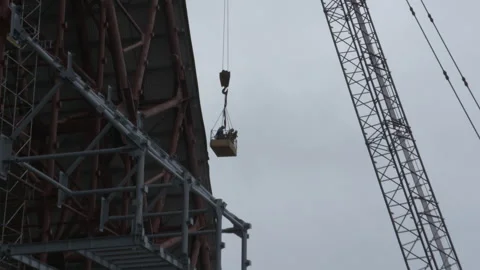 Construction workers in a crane basket at Chernobyl NSC Stock Footage 345292776