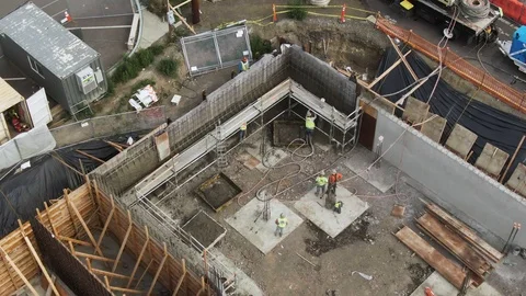 Construction workers creating concrete wall Stock Footage 117184233