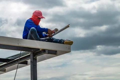 Construction workers cutting steel. Stock Photos