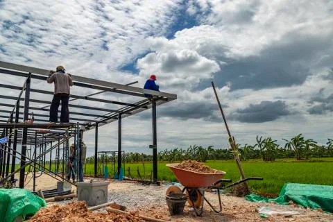 Construction workers cutting steel. Stock Photos