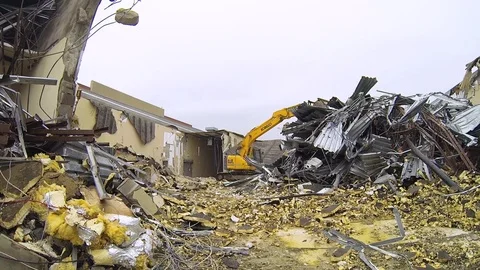 Construction workers at demolition site working heavy machinery B Stock Footage 125056267