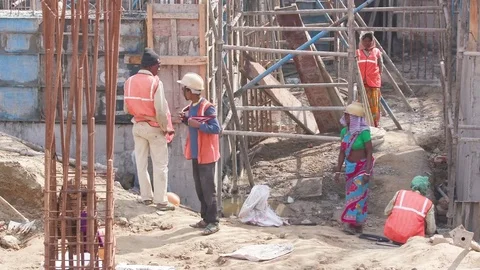 Construction workers on a developing construction site Stock Footage 77447732