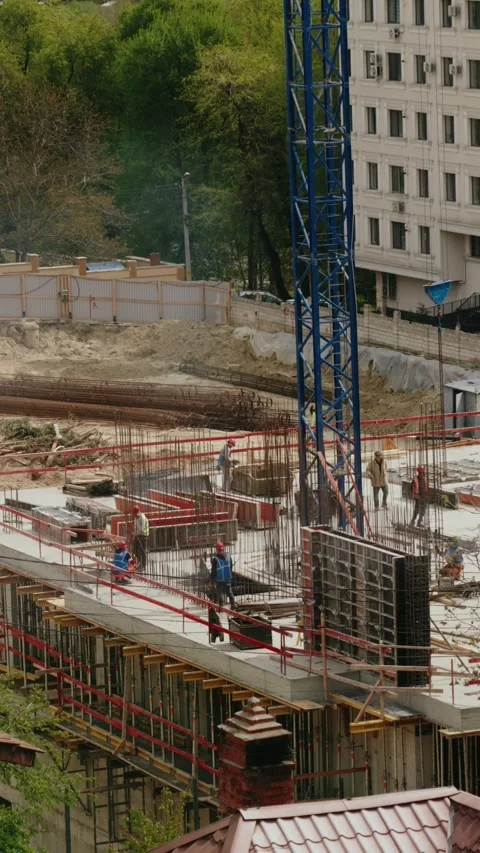 Construction workers developing a high-rise building project Stock Footage 345519635