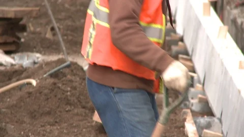 Construction workers digging holes Stock Footage 104879920