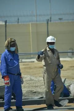 Construction workers digging trench using shovels. Abu Dhabi,UAE.03.10.2020. Stock Photos