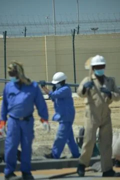 Construction workers digging trench using shovels. Abu Dhabi,UAE.03.10.2020. Stock Photos