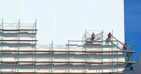 Construction workers disassemble a scaffolding on a Dolby Theater in Los Angeles 動画素材 214450375