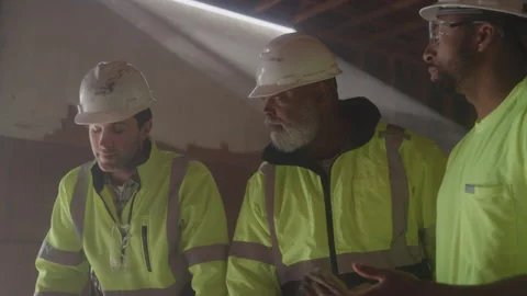 Construction Workers Discuss Job Site Wearing Hard Hats Stock Footage 270388432