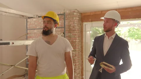 Construction workers discussed their project progress in a recently renovated Vídeo Stock 307836132