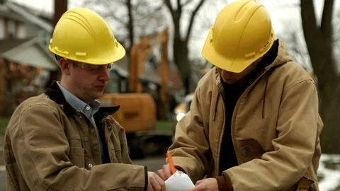 Construction workers discussing plans  4k Stock Footage 88961074