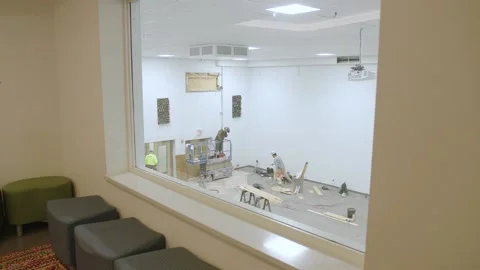 Construction workers doing refurbishments Stock Footage 238859574