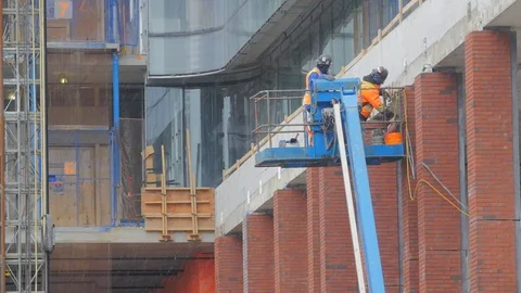 Construction Workers Drilling Highrise Hoist Lift Condo Development Pr Video stock 87430835