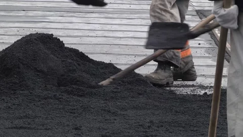 Construction workers during asphalting road works wearing coveralls Video stock 223819135