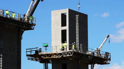 Construction workers on elevator tower Stock Footage 73777250