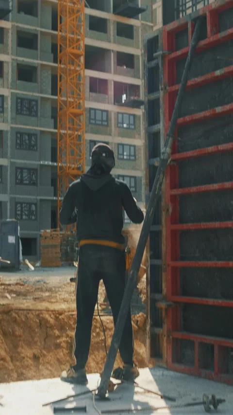Construction workers erecting walls at a large construction site Stock-Footage 346703515