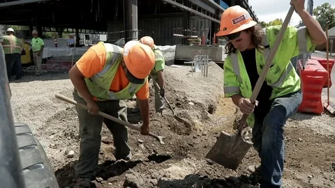 Construction Workers Filling Hole with Dirt Stock Footage