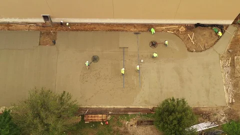 Construction Workers Finishing Concrete Pavement, Bryan, Texas, USA Stock Footage 129395786