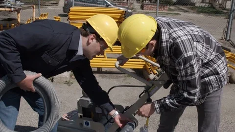 Construction workers getting pump ready Stock Footage 88961132