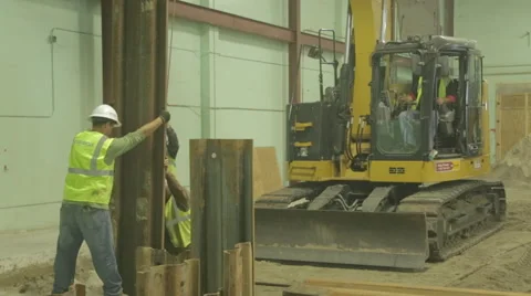 Construction Workers Guiding Steel Beam On Construction Site 5 Stock Footage 46580663