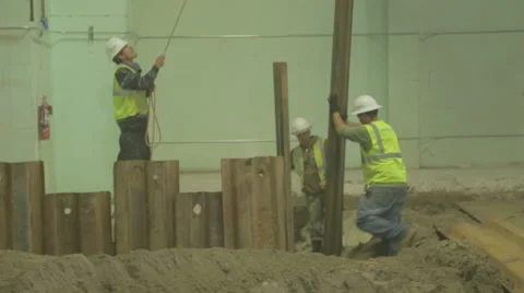 Construction Workers Guiding Steel Beam On Construction Site 3 Stock Footage 46580871