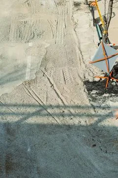Construction worker's hand holding a trowel on a brick wall Stock Photos