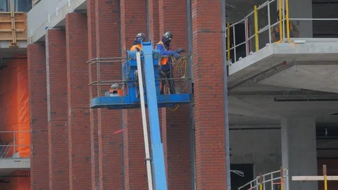 Construction Workers Highrise Exiting Moving Hoist Lift Condo Developm Stockbeeldmateriaal 87430794