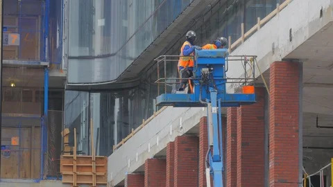 Construction Workers Highrise Moving Hoist Lift Condo Development Prog Stock Footage 87430626