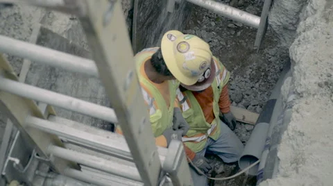 Construction Workers in a Hole - Super Slow Motion 240 FPS Stock Footage 63343308