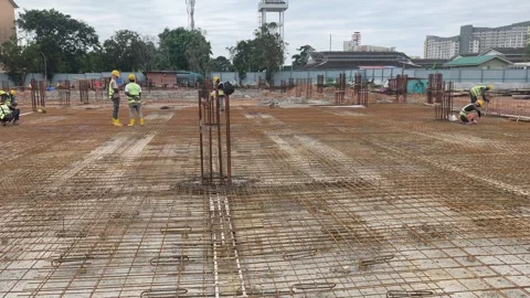 Construction Workers Installing BRC Steel Mesh for Reinforced Concrete Floor Stock Footage 336644538