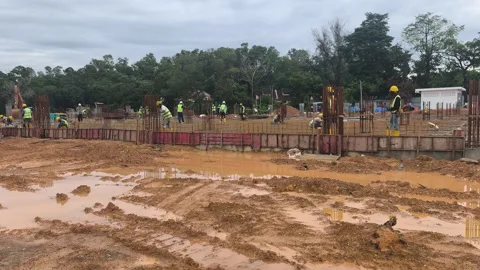 Construction Workers Installing BRC Steel Mesh for Reinforced Concrete Floor Stock Footage 336644540