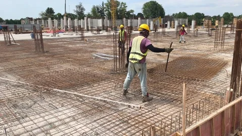 Construction Workers Installing BRC Steel Mesh for Reinforced Concrete Floor Stock Footage 336644548