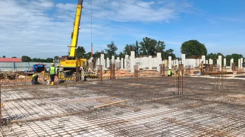 Construction Workers Installing BRC Steel Mesh for Reinforced Concrete Floor Stock Footage 336644551