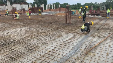 Construction Workers Installing BRC Steel Mesh for Reinforced Concrete Floor Stock Footage 336644560