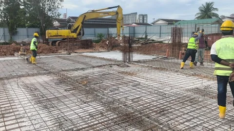 Construction Workers Installing BRC Steel Mesh for Reinforced Concrete Floor Stock Footage 336644588