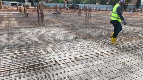 Construction Workers Installing BRC Steel Mesh for Reinforced Concrete Floor Stock Footage 336644621