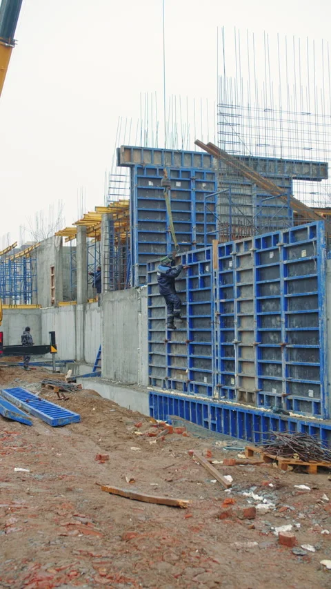Construction Workers Installing Concrete Formwork Stock Footage 296756034