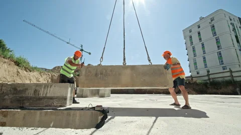 Construction Workers Installing Concrete Slab with Crane, Heavy Lifting Stock Footage 312443942