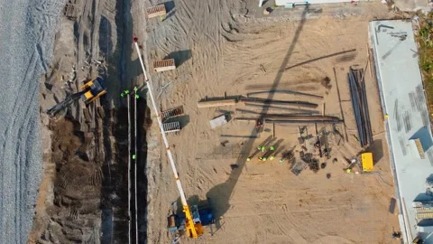 Construction workers installing deep trench shoring system Video stock 285648113