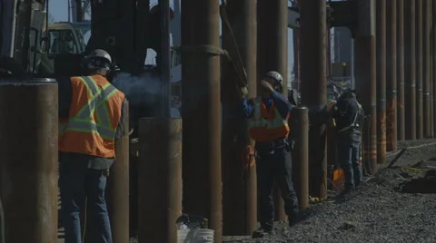 Construction workers installing foundation piles Stock Footage 65051636