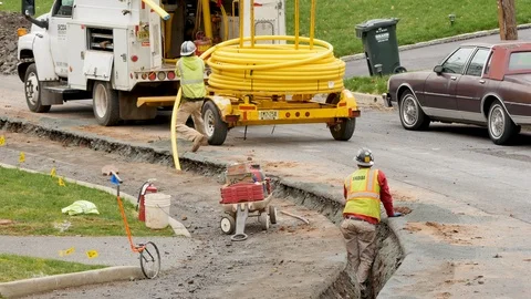 Construction workers installing a gas line Stock Footage 106365158