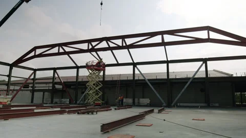Construction Workers Installing Large Steel Beam To Structure 4K 48FPS SLO-M Stock Footage 265803153