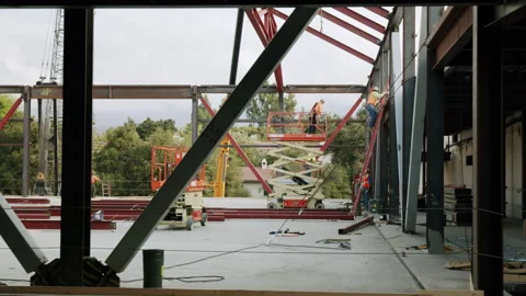 Construction Workers Installing Large Steel Beam On Scissor Lift 4K 48FPS SL Stock Footage 265804172