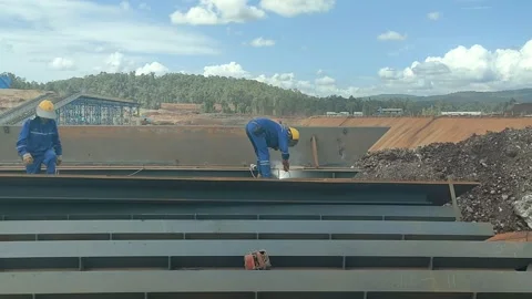 Construction Workers Installing Metal Roof Panels at Industrial Project Stock Footage 337146805
